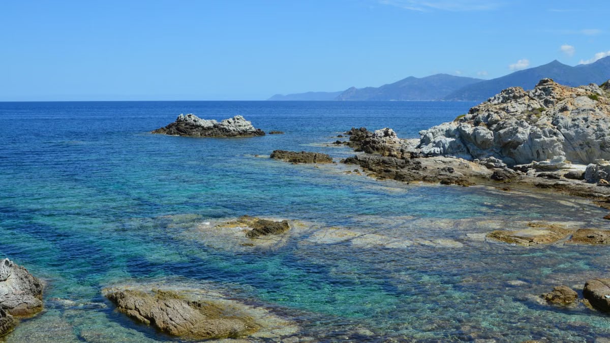 Explore the rugged coastline of Santo-Pietro-di-Tenda, Corse with clear blue waters.
